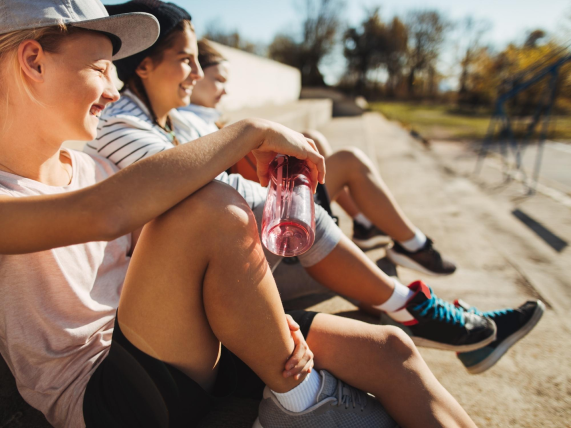 three youth from right profile in sports stands